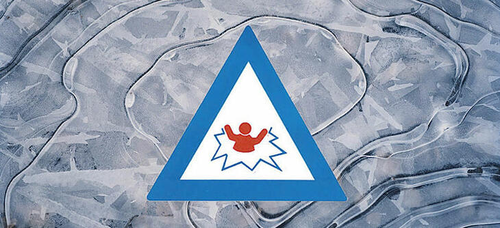 Ice on water with warning sign for unsafe ice